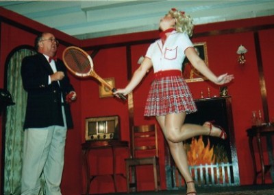 "Tennis Anyone?" asks Felicity (Lynsey Collis) of Birdboot (Chris Crowley)